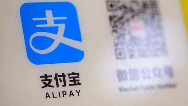 FILE PHOTO: A logo of the electronic payment service Alipay that belongs to Ant Group Co Ltd  is seen at a vending machine in Beijing, China December 30, 2020. REUTERS/Thomas Peter/File Photo