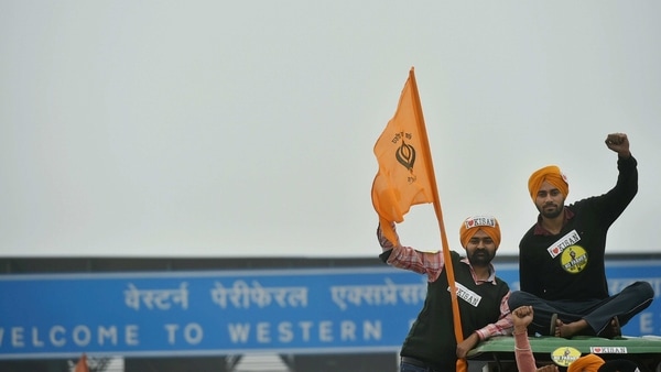 Farmers on their way to Tikri border during a tractor rally as part of their ongoing protest against the new farm laws, at Western Peripheral Expressway in Kundli, Sonipat, Thursday, Jan. 07, 2021.