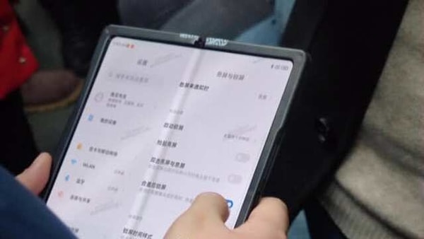 From the images, it appears that the device folds in half with a hinge that looks inspired by the Samsung Galaxy Fold 2.