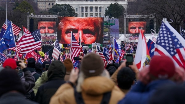 In this January 6, 2021, file photo, Trump supporters participate in a rally in Washington. Far-right social media users for weeks openly hinted in widely shared posts that chaos would erupt at the US Capitol while Congress convened to certify the election results. 