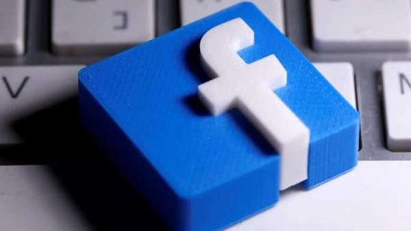 FILE PHOTO: A 3D-printed Facebook logo is seen placed on a keyboard in this illustration taken March 25, 2020. REUTERS/Dado Ruvic/Illustration