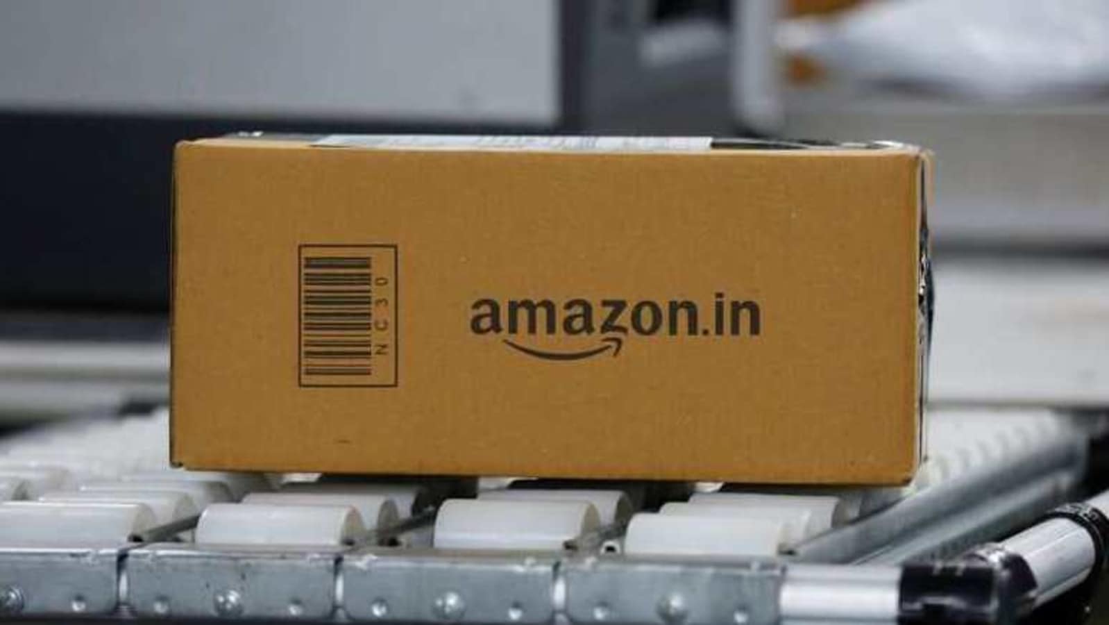 FILE PHOTO: A shipment moves on a conveyor belt at an Amazon Fulfillment Centre (BLR7) on the outskirts of Bengaluru, India, September 18, 2018. REUTERS/ Abhishek N. Chinnappa