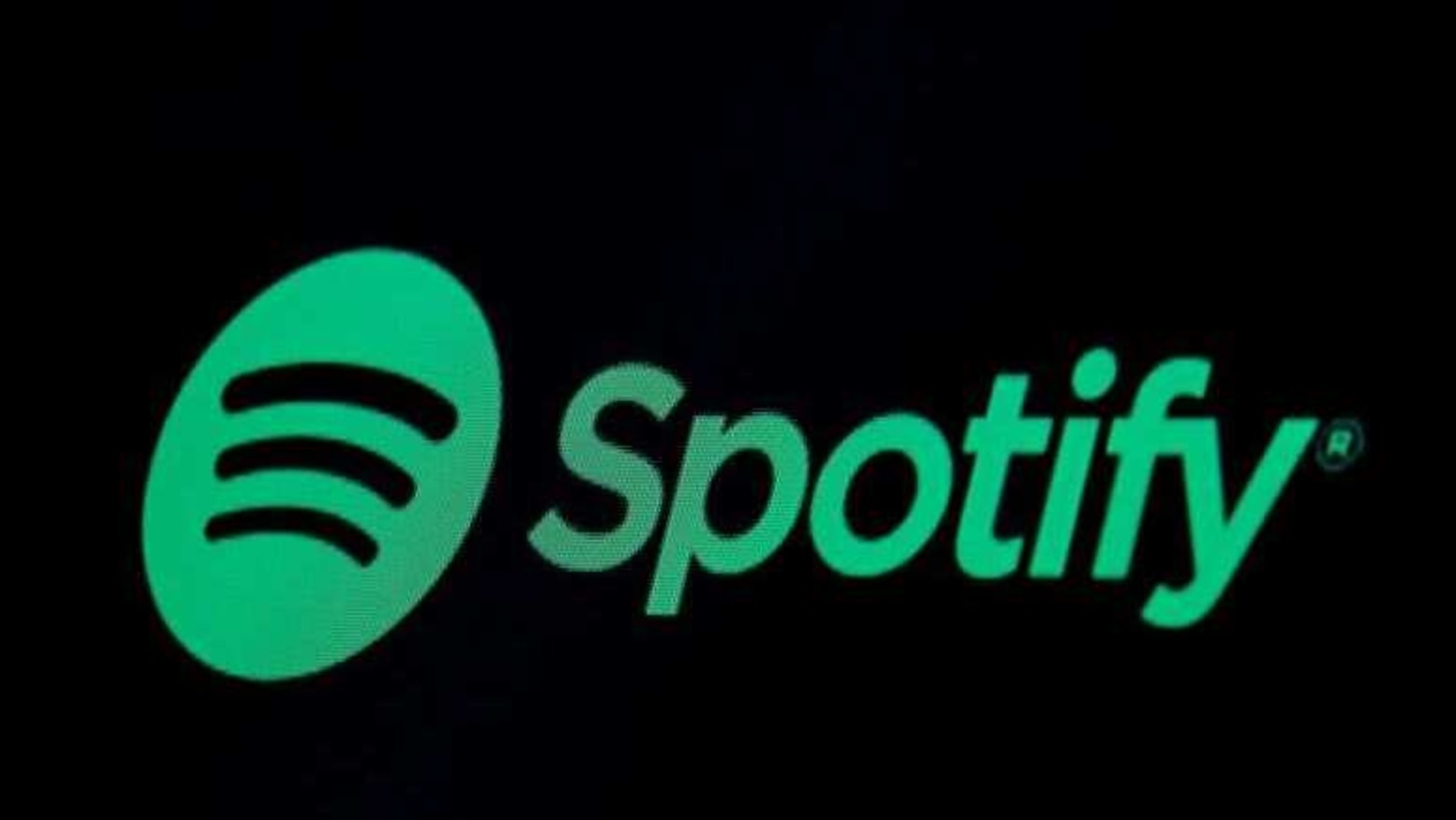 FILE PHOTO: The Spotify logo is displayed on a screen on the floor of the New York Stock Exchange (NYSE) in New York, U.S., May 3, 2018. REUTERS/Brendan McDermid/File Photo