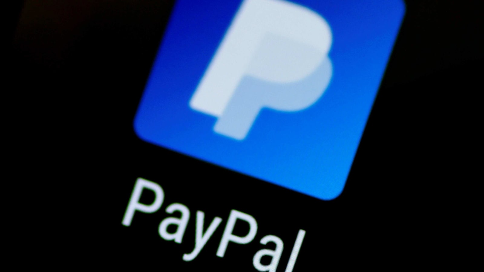 FILE PHOTO: The PayPal app logo is seen on a mobile phone in this illustration photo, Oct. 16, 2017. REUTERS/Thomas White/File Photo