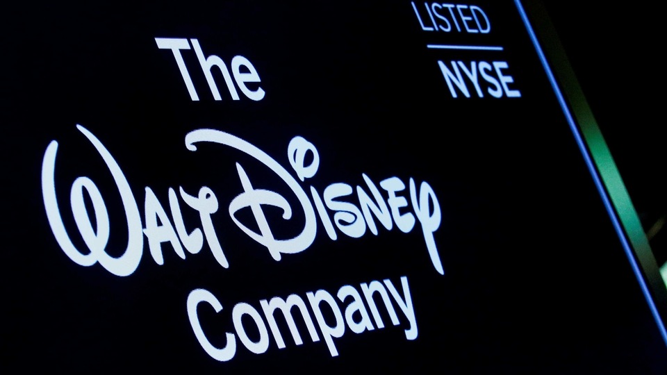 FILE PHOTO: A screen shows the logo and a ticker symbol for The Walt Disney Company on the floor of the New York Stock Exchange (NYSE) in New York, U.S., December 14, 2017. REUTERS/Brendan McDermid/File Photo