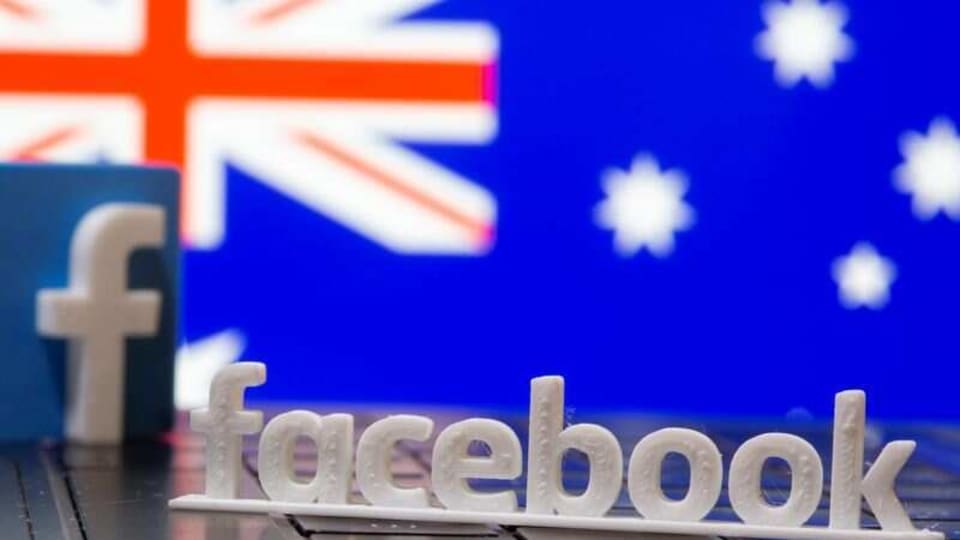 A 3D printed Facebook logo is seen in front of displayed Australia's flag in this illustration photo taken February 18, 2021. REUTERS/Dado Ruvic/Illustration
