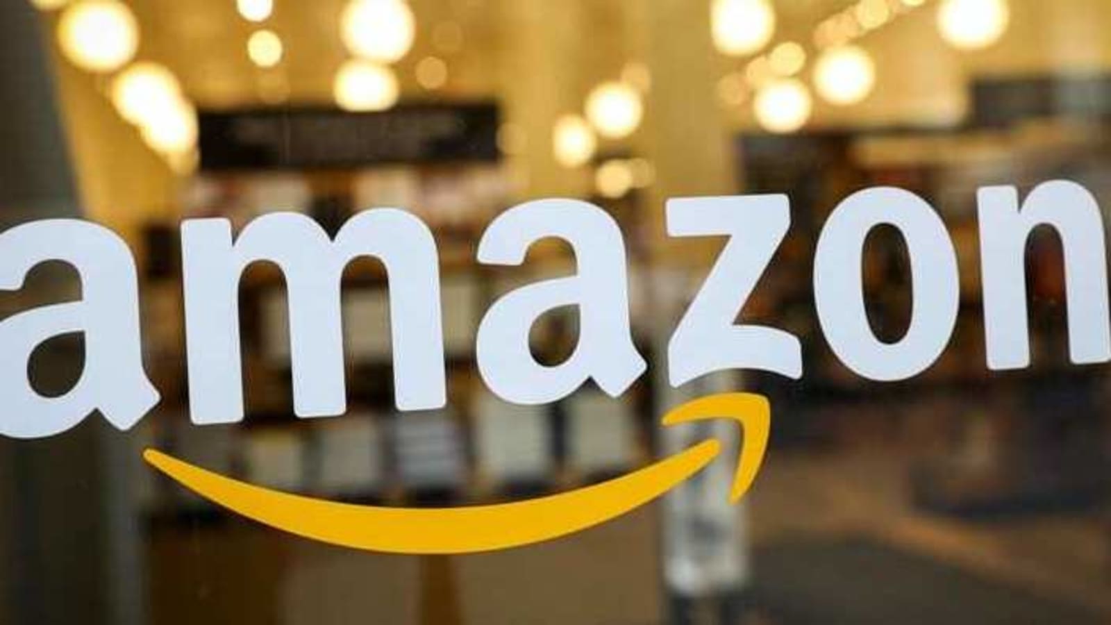 FILE PHOTO: The logo of Amazon is seen on the door of an Amazon Books retail store in New York City, U.S., February 14, 2019. REUTERS/Brendan McDermid/File Photo