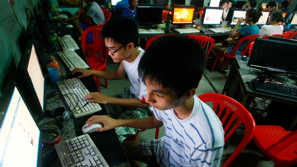 Two students use computers at an internet cafe near their dormitory in Hanoi, Vietnam. Amnesty International has found that a hacking group known as Ocean Lotus has been staging more spyware attacks on Vietnamese human rights activists in the latest blow to freedom of speech in the communist-ruled country.
