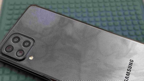 The back of the Galaxy F62 looks just like a mirror, with a sleek pinstripe design. 
