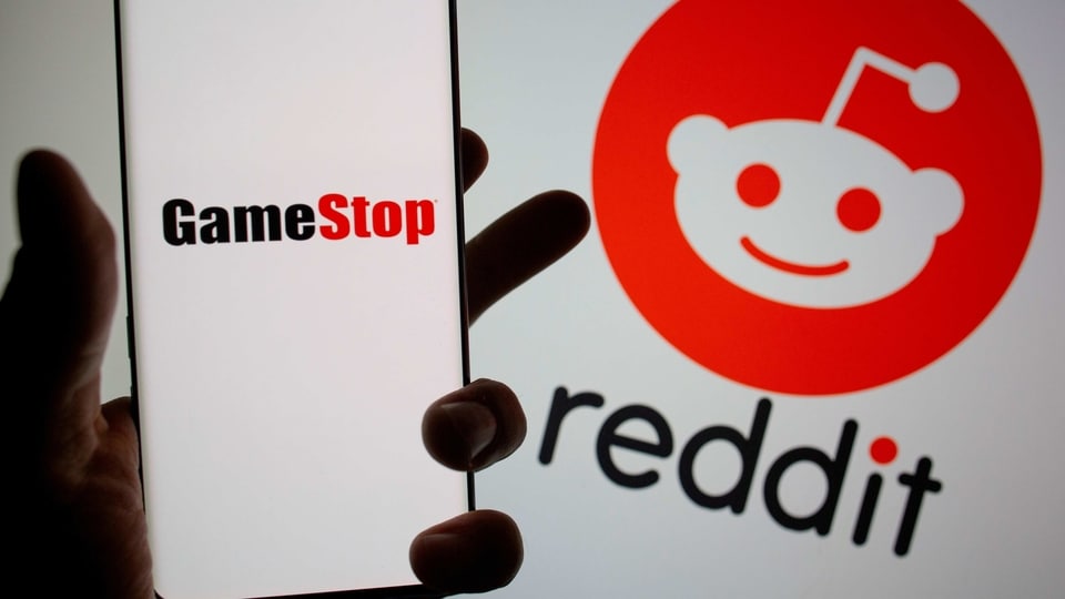 FILE PHOTO: GameStop logo is seen in front of displayed Reddit logo in this illustration taken on Febr. 2, 2021. REUTERS/Dado Ruvic/Illustration//File Photo/File Photo