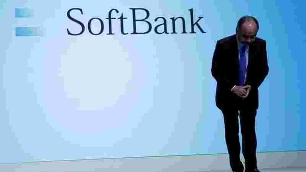 Japan's SoftBank Group Corp Chief Executive Masayoshi Son bows his head after his presentation at a news conference in Tokyo.