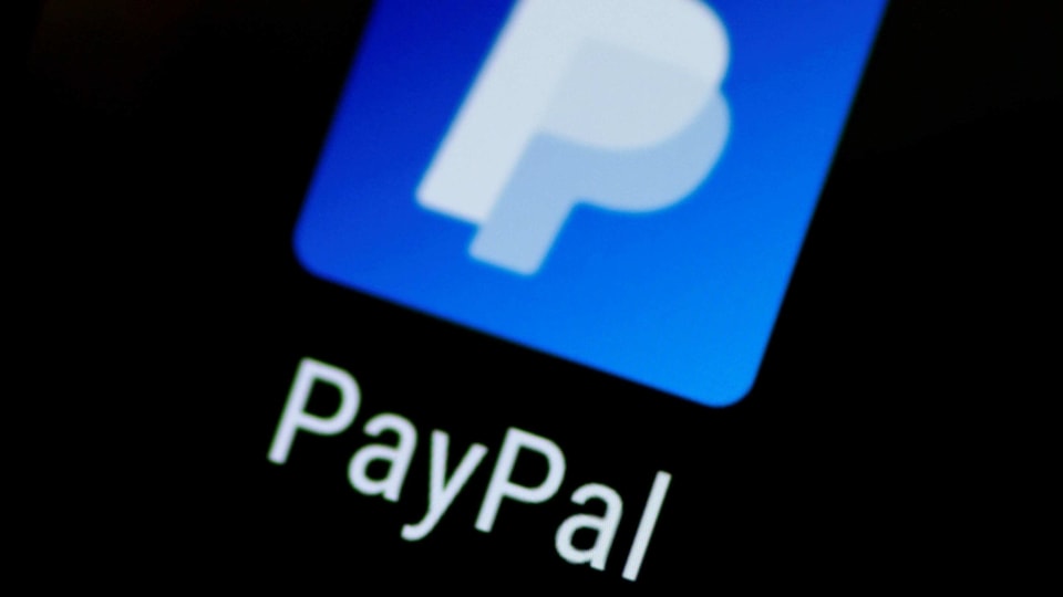 FILE PHOTO: The PayPal app logo is seen on a mobile phone in this illustration photo, Oct. 16, 2017. REUTERS/Thomas White/File Photo