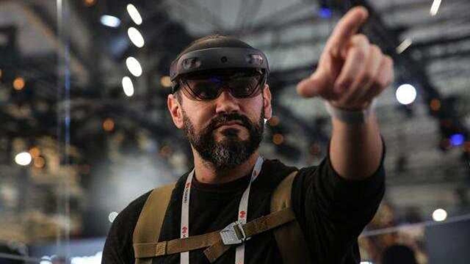 An attendee wears a Microsoft Corp. HoloLens 2 headset as he uses the Bentley Systems Inc. Synchro XR augmented reality (AR) app, at the Microsoft Corp. stand on the opening day of the MWC Barcelona 