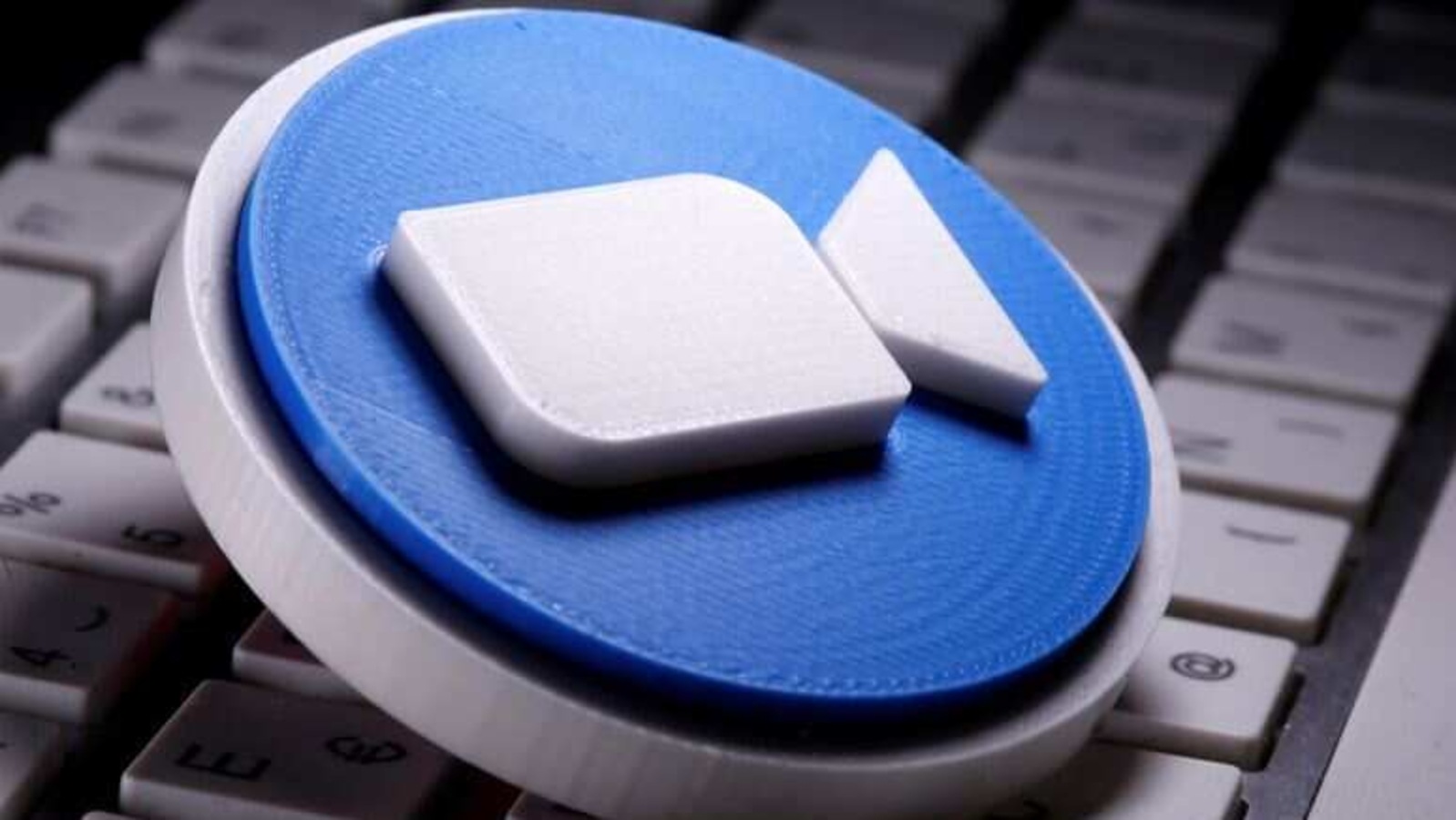 FILE PHOTO: A 3D printed Zoom logo is placed on the keyboard in this illustration taken April 12, 2020. REUTERS/Dado Ruvic/Illustration