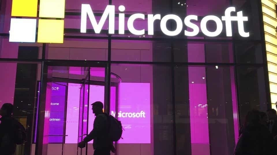 People walk near a Microsoft office in New York.