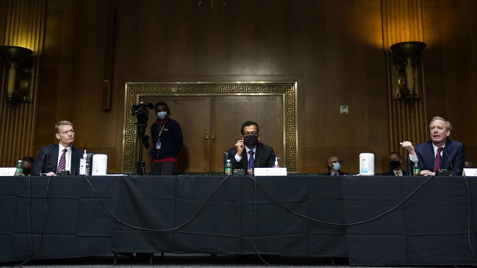 Kevin Mandia, chief executive officer of FireEye Inc., from left, Sudhakar Ramakrishna, chief executive officer of SolarWinds Corp., and Brad Smith, president of Microsoft Corp., attend a Senate Intelligence Committee hearing in Washington, D.C., U.S., on Tuesday, Feb. 23, 2021. The suspected Russian hackers who compromised software created by SolarWinds to break into American agencies and companies used a cyber weapon 