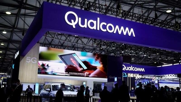 FILE PHOTO: People visit a Qualcomm booth at the Mobile World Congress (MWC) in Shanghai, China February 23, 2021. REUTERS/Aly Song