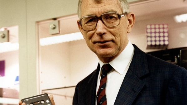 In this photo dated 1988, structural engineer Lou Ottens holding an audio cassette poses for a photo. The Dutch inventor of the cassette tape, Ottens died Saturday March 6, 2021, at the age of 94, according to an announcement issued by the Philips company. 