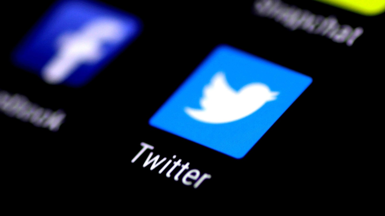 The Twitter application is seen on a phone screen.