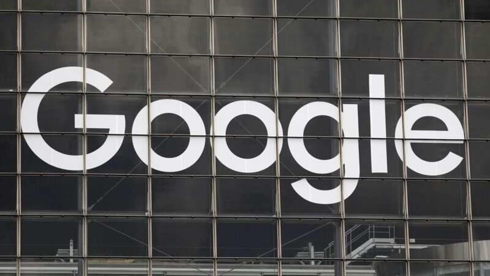 FILE PHOTO: The logo of Google is seen on a building at La Defense business and financial district in Courbevoie near Paris, France, September 1, 2020.  REUTERS/Charles Platiau/File Photo