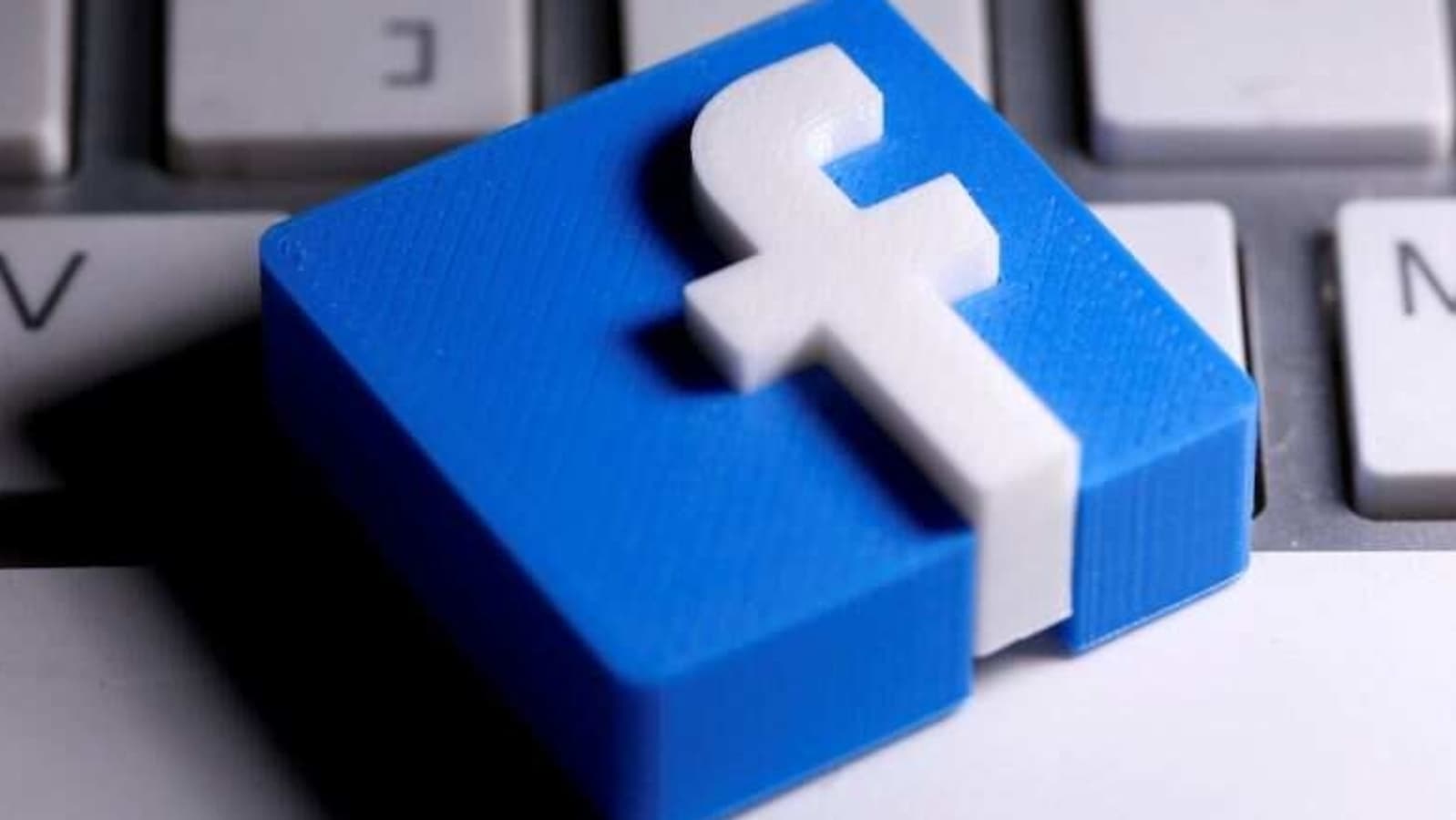 FILE PHOTO: A 3D-printed Facebook logo is seen placed on a keyboard in this illustration taken March 25, 2020. REUTERS/Dado Ruvic/Illustration/File Photo