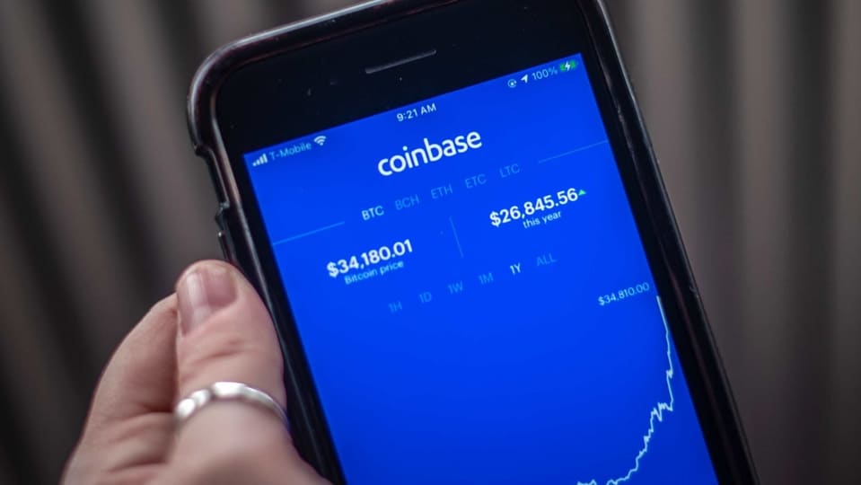 Coinbase swung from a loss to a profit of $322 million last year on net revenue that more than doubled to $1.14 billion.Photographer: Tiffany Hagler-Geard/Bloomberg