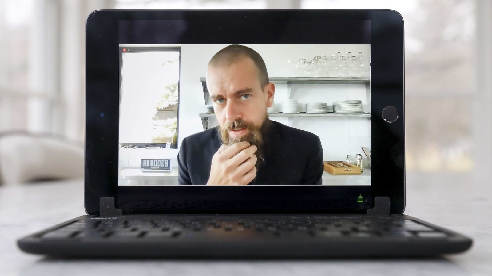 Jack Dorsey, chief executive officer of Twitter Inc., speaks virtually during a House Energy and Commerce Subcommittees hearing on a laptop computer in Tiskilwa, Illinois, U.S., on Thursday, March 25, 2021. The chief executives of Facebook, Google, and Twitter are testifying as lawmakers on both sides of the aisle prepare to press the companies over the spread of false information that contributed to the deadly Jan. 6 Capitol attacks. Photographer: Daniel Acker/Bloomberg