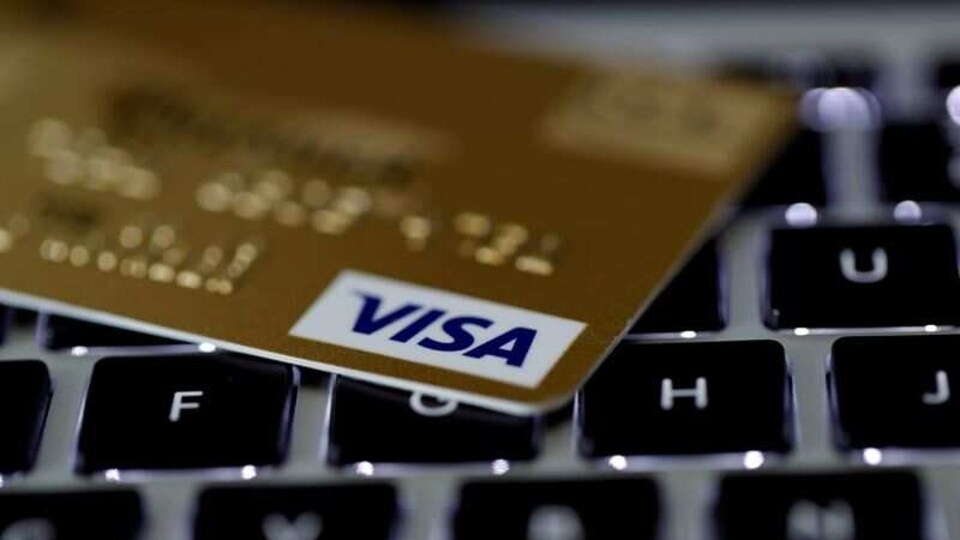 FILE PHOTO: A Visa credit card is seen on a computer keyboard in this picture illustration taken September 6, 2017. REUTERS/Philippe Wojazer/Illustration/File Photo/File Photo