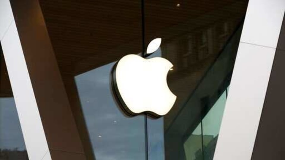 FILE - In this Saturday, March 14, 2020 file photo, an Apple logo adorns the facade of the downtown Brooklyn Apple store in New York. 