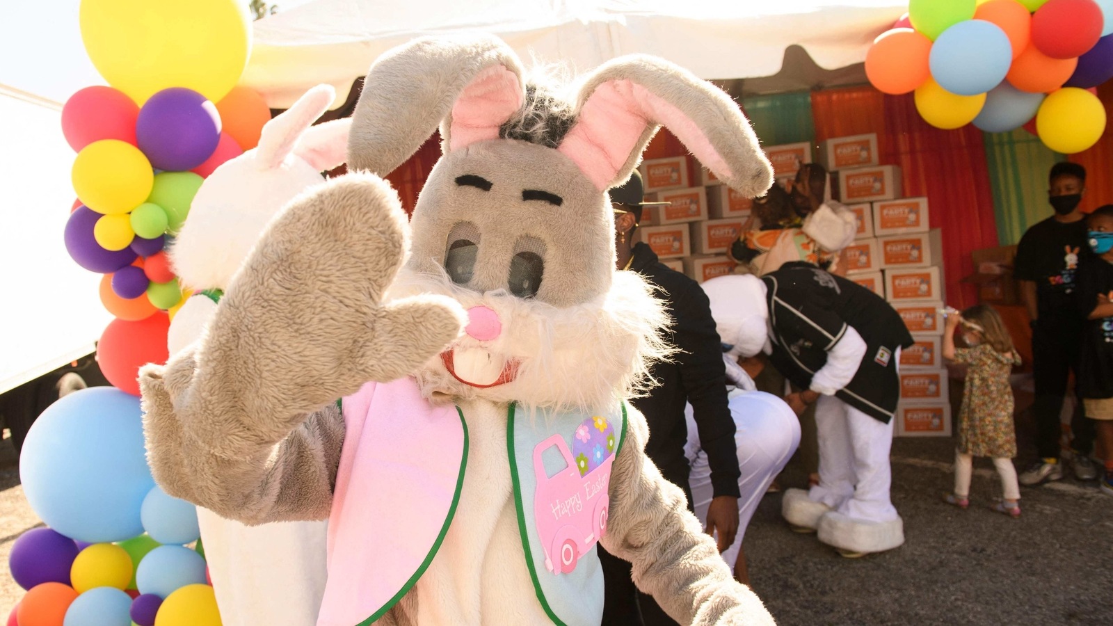 Volunteers distribute Easter themed kits to families to host their own Covid-19 pandemic safe celebrations during a drive-in Easter Eggstravaganza for children including foster youth during an event held by Guardians of Love and Los Angeles Mission on April 2, 2021 in Los Angeles, California. 