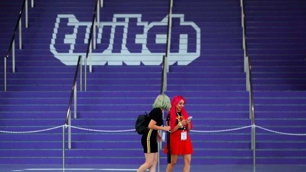 FILE PHOTO: Attendees walk past a Twitch logo painted on stairs during opening day of E3, the annual video games expo revealing the latest in gaming software and hardware in Los Angeles, California, U.S., June 11, 2019.  REUTERS/Mike Blake