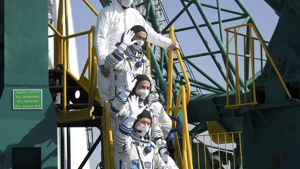 The International Space Station (ISS) crew members Mark Vande Hei of NASA, cosmonauts Oleg Novitskiy and Pyotr Dubrov of Roscosmos wave farewell prior to boarding the Soyuz MS-18 spacecraft for the launch at the Baikonur Cosmodrome, Kazakhstan April 9, 2021. Roscosmos/Handout via REUTERS ATTENTION EDITORS - THIS IMAGE HAS BEEN SUPPLIED BY A THIRD PARTY. MANDATORY CREDIT.
