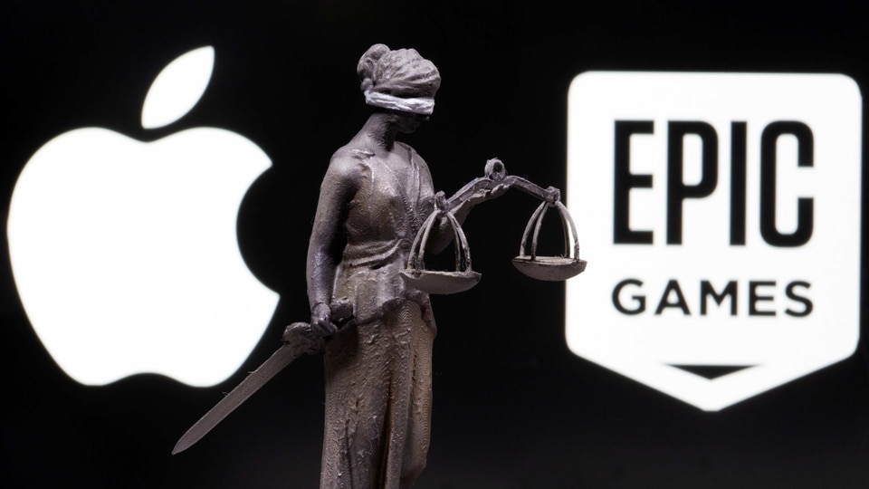 FILE PHOTO: 3D printed Lady Justice figure is seen in front of displayed Apple and Epic Games logos in this illustration photo taken February 17, 2021. REUTERS/Dado Ruvic/Illustration/File Photo