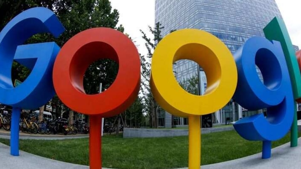 FILE PHOTO: The brand logo of Alphabet Inc's Google is seen outside its office in Beijing, China August 8, 2018.  Picture taken with a fisheye lens. REUTERS/Thomas Peter/File Photo