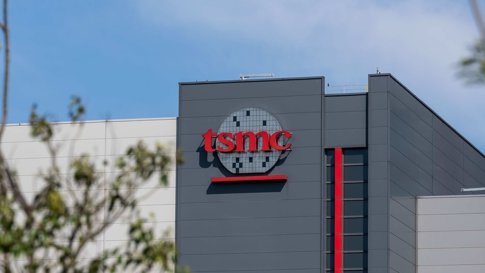 Logo at the Taiwan Semiconductor Manufacturing Co. headquarters in Hsinchu, Taiwan, on Wednesday, April 7, 2021. The TSMC�is a key supplier to Apple, and it�s the iPhone maker�s commitment to become carbon neutral by 2030 that is driving much of the change throughout the supply chain. Photographer: Billy H.C. Kwok/Bloomberg