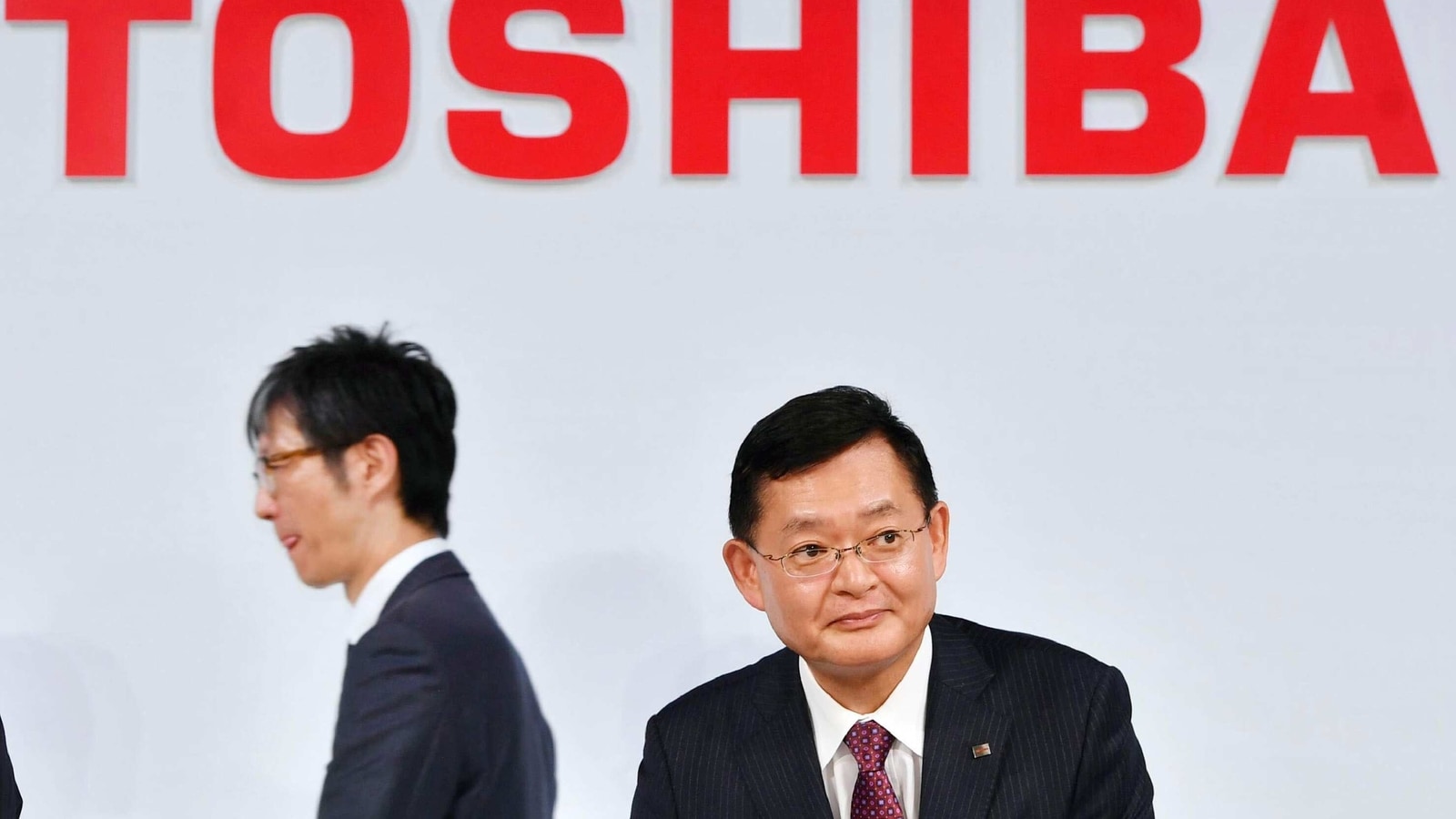 FILE PHOTO: In this November 2018, photo, then Toshiba Corp., Chairman and CEO Nobuaki Kurumatani gets out of a seat after a press conference in Tokyo. 