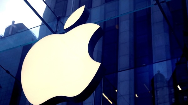 FILE PHOTO: The Apple Inc logo is seen hanging at the entrance to the Apple store on 5th Avenue in Manhattan, New York, U.S., October 16, 2019. REUTERS/Mike Segar/File Photo