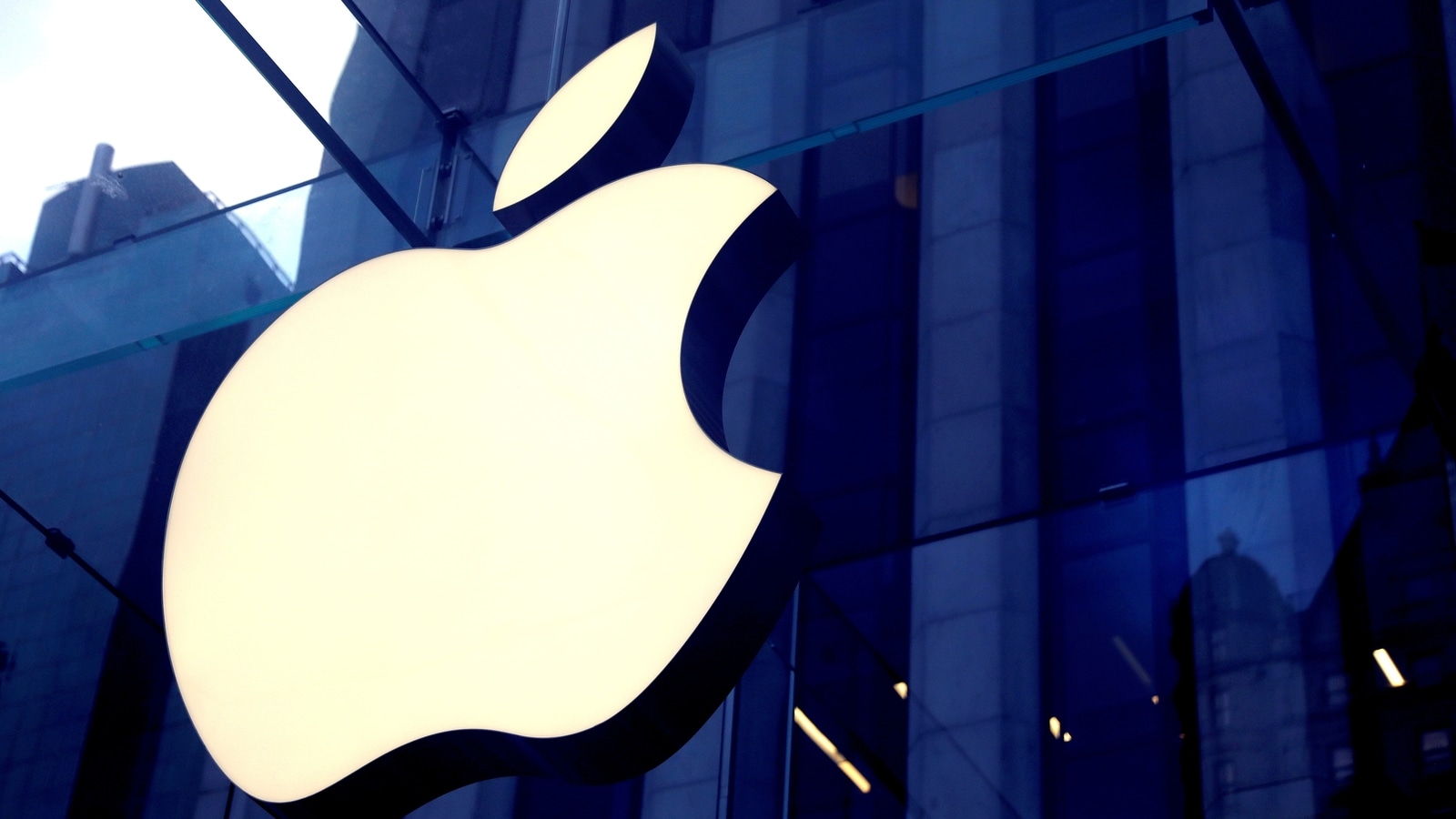 FILE PHOTO: The Apple Inc logo is seen hanging at the entrance to the Apple store on 5th Avenue in Manhattan, New York, U.S., October 16, 2019. REUTERS/Mike Segar/File Photo