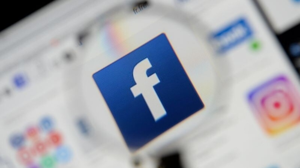 FILE PHOTO: The Facebook logo is seen on a screen in this picture illustration taken December 2, 2019. REUTERS/Johanna Geron/Illustration/File Photo