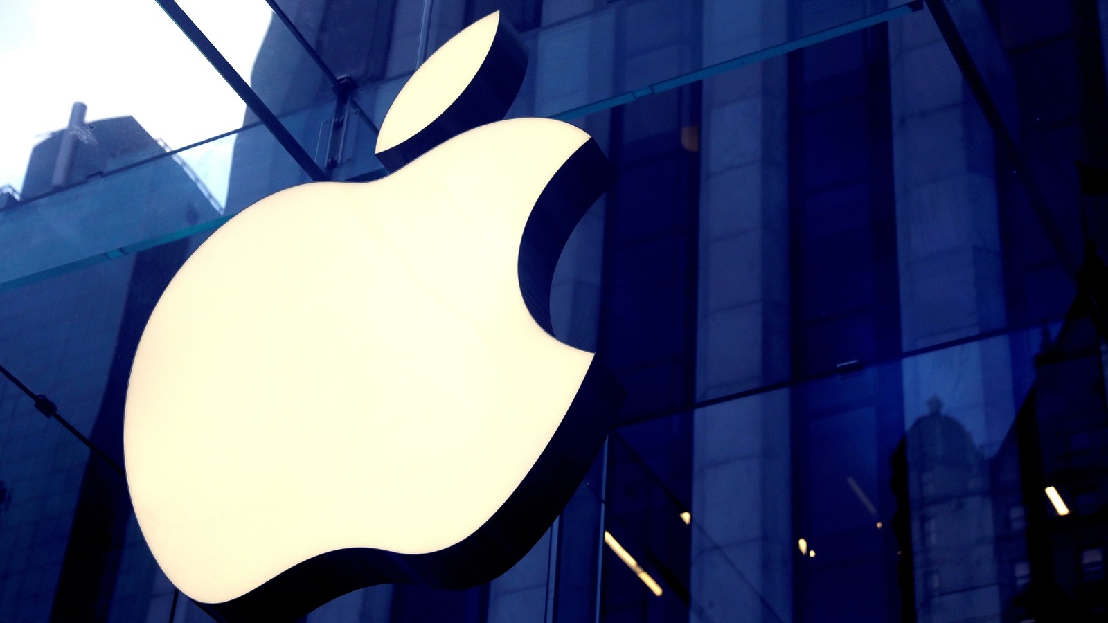 FILE PHOTO: The Apple Inc logo is seen hanging at the entrance to the Apple store on 5th Avenue in Manhattan, New York, US, October 16, 2019.