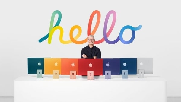 Apple CEO Tim Cook stands with the all-new iMac lineup, in this still image from the keynote video of a special event at Apple Park in Cupertino, California, U.S. released April 20, 2021. Apple Inc./Handout via REUTERS