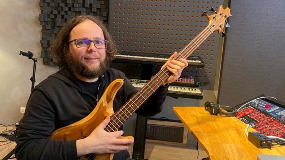 Michele Benincaso, founder of Elk, poses with a guitar in his office in Stockholm, Sweden, April 14, 2021. Picture taken April 14, 2021.