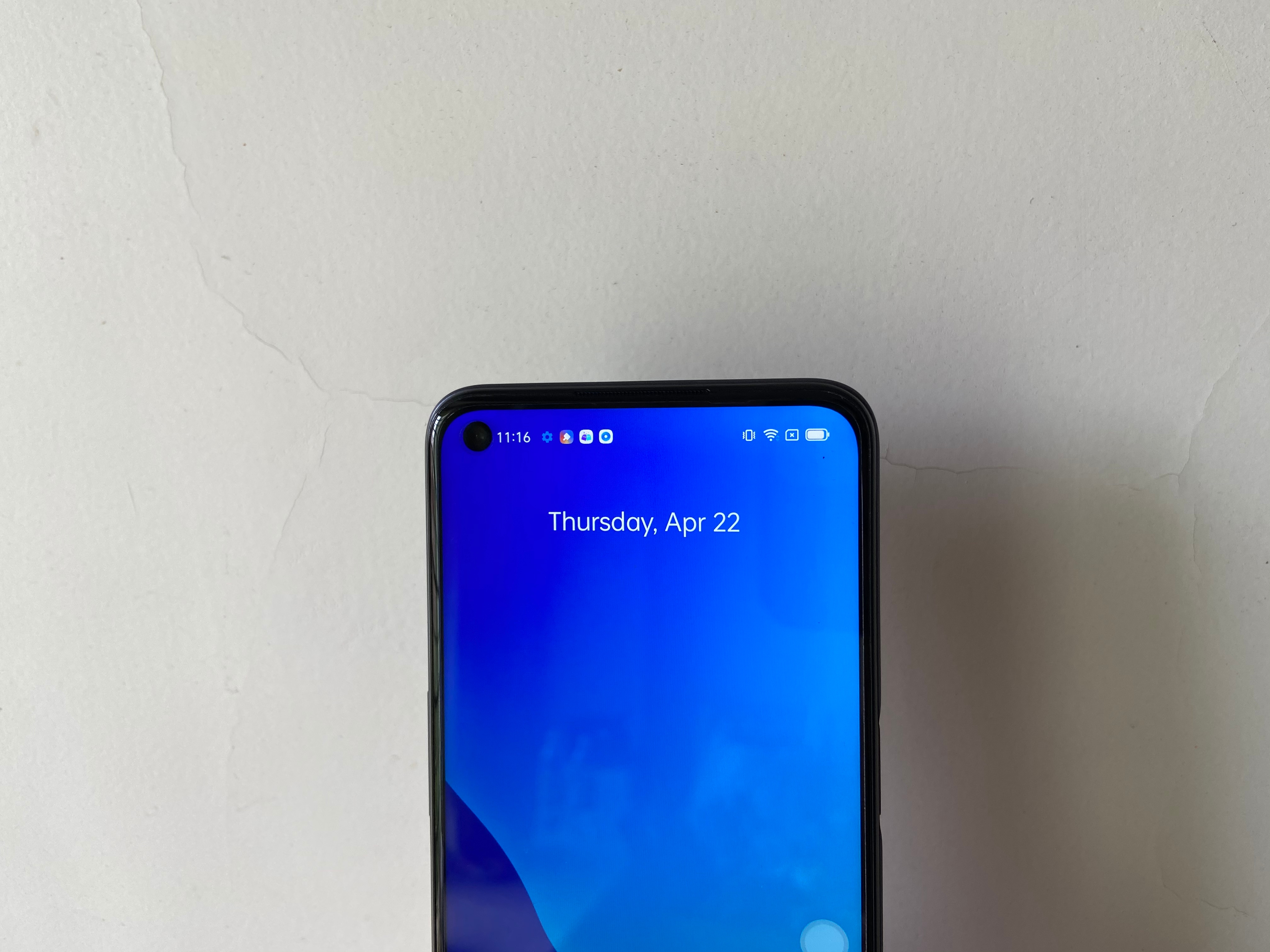 On the front of the device is a 16 MP selfie shooter housed in a punch hole on the LCD display.