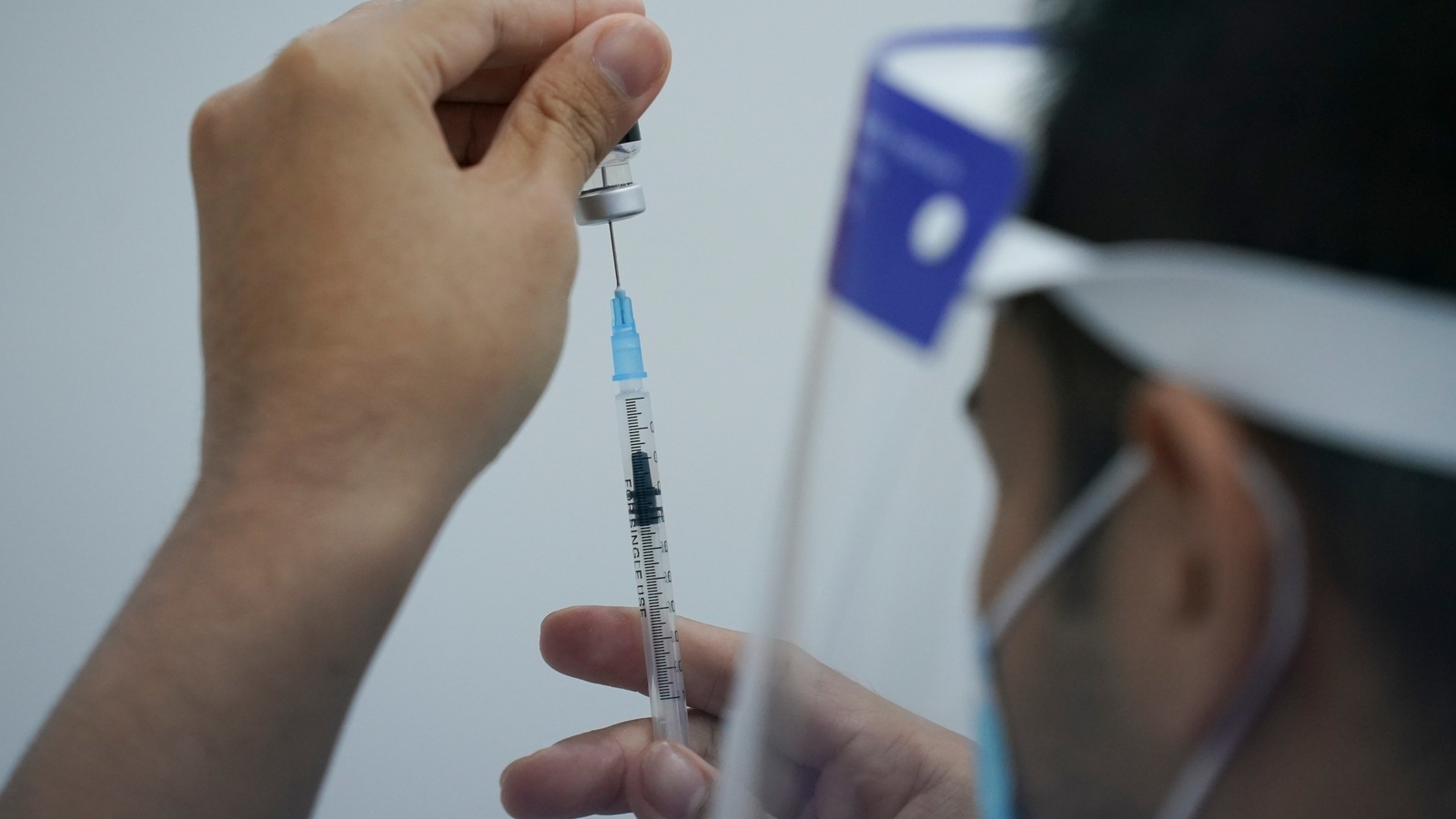 A health worker prepares to administer the Pfizer's COVID-19 vaccine at a vaccination center in Subang Jaya, Malaysia, Tuesday, April 27, 2021. (AP Photo/Vincent Thian)