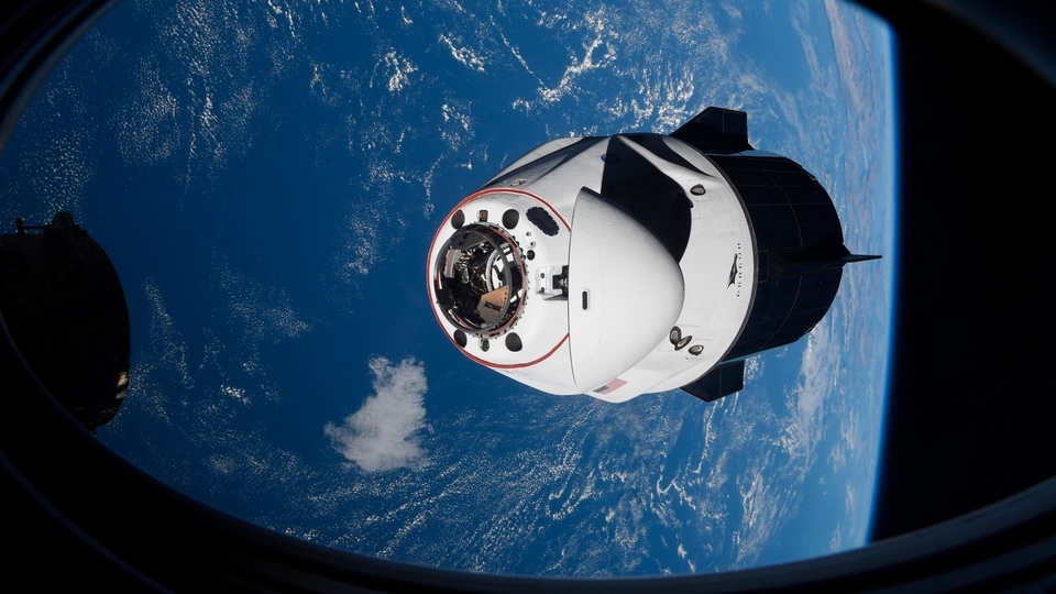In this Saturday, April 24, 2021 photo made available by NASA, the SpaceX Crew Dragon capsule approaches the International Space Station for docking. SpaceX's four astronauts had barely settled into orbit on Friday, 