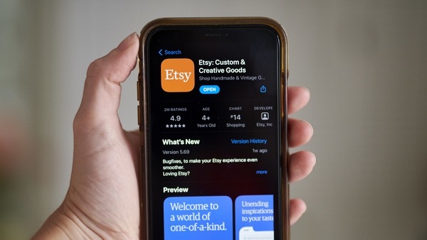 FILE PHOTO: The Etsy Inc. application for download in the Apple Inc. App Store on a smartphone arranged in Saint Thomas, Virgin Islands, U.S., on Friday, Feb. 19, 2021 