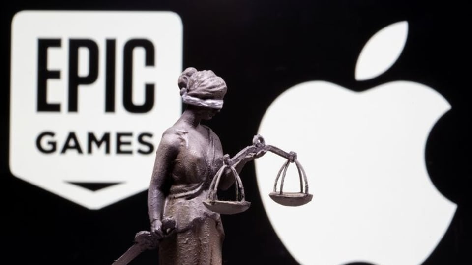 FILE PHOTO: 3D printed Lady Justice figure is seen in front of displayed Apple and Epic Games logos in this illustration photo taken February 17, 2021. 