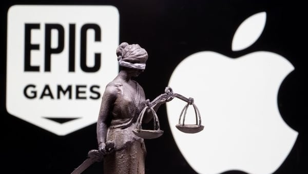 FILE PHOTO: 3D printed Lady Justice figure is seen in front of displayed Apple and Epic Games logos in this illustration photo taken February 17, 2021. 