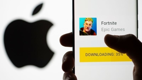 FILE PHOTO: Fortnite game download on Android operating system is seen in front of Apple logo in this illustration taken, May 2, 2021. REUTERS/Dado Ruvic/Illustration