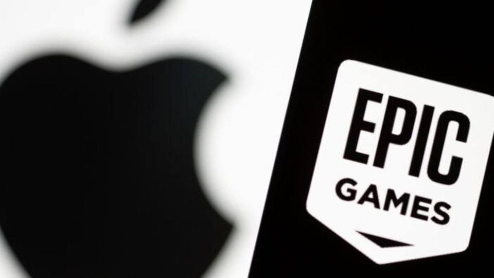 Smartphone with Epic Games logo is seen in front of Apple logo in this illustration taken, May 2, 2021. REUTERS/Dado Ruvic/Illustration